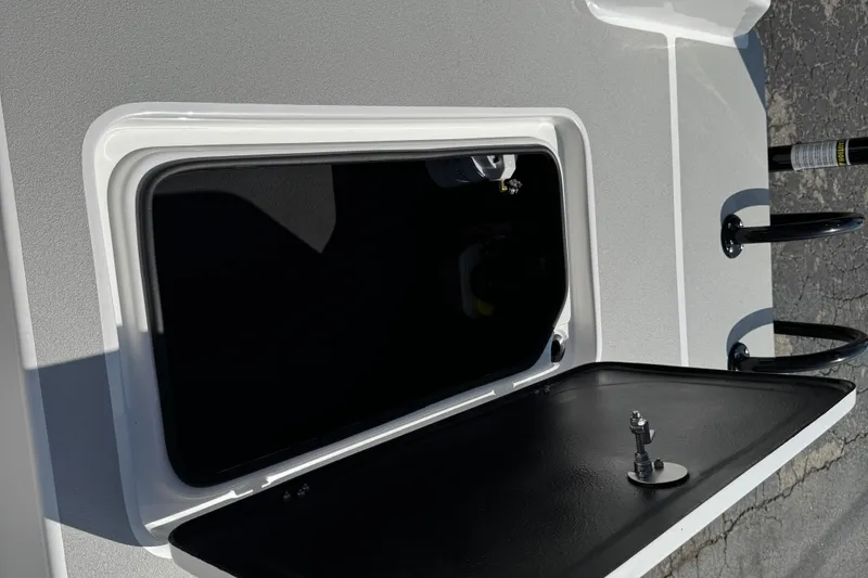 Slide: The Image of Open storage compartment on 2026 SCB R24 boat deck. - 41