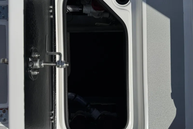 Slide: The Image of Open hatch on 2026 SCB R24 boat, showing interior compartment. - 43