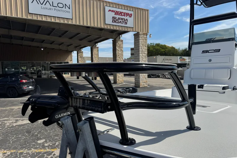 Slide: The Image of 2026 SCB R24 boat with Garmin equipment at dealership, featuring Avalon and Supra Boats signage. - 6