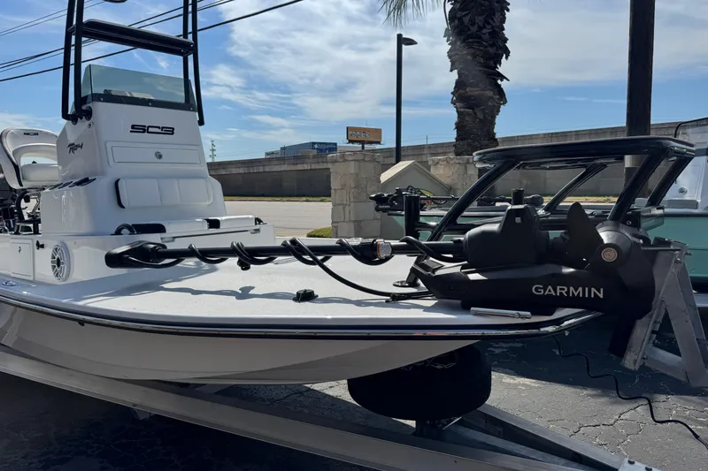 Slide: The Image of 2026 SCB R24 boat with Garmin equipment, parked outdoors under a clear sky. - 7