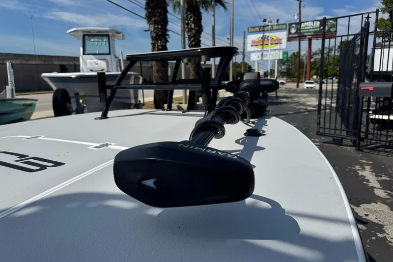 Slide: The Image of 2026 SCB R24 boat with Garmin equipment, parked outdoors near marine dealership. - 8