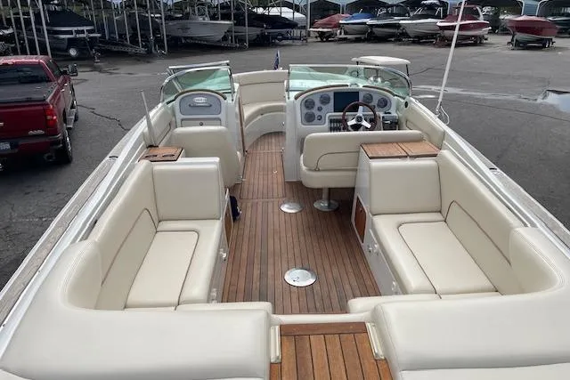 Slide: The Image of 2008 Chris-Craft Launch 28 boat with spacious seating and elegant wooden deck. - 10