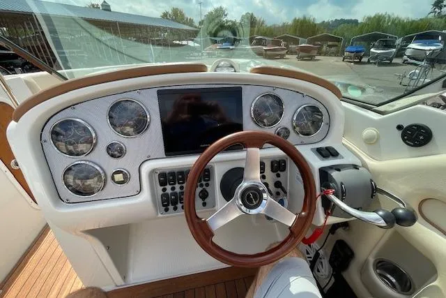 Slide: The Image of Dashboard of 2008 Chris-Craft Launch 28 boat with steering wheel and gauges. - 15