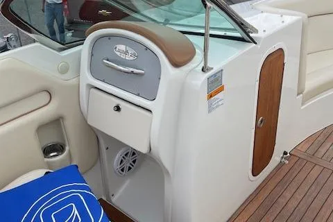 Slide: The Image of 2008 Chris-Craft Launch 28 boat interior with wood accents and seating. - 20