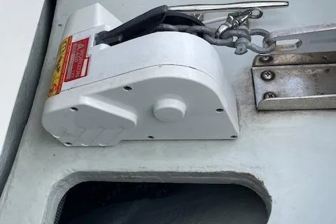 Slide: The Image of 2008 Chris-Craft Launch 28 boat anchor mechanism with chain and metal fittings. - 23