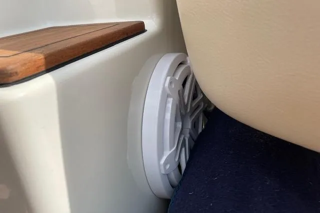 Slide: The Image of Speaker on 2008 Chris-Craft Launch 28 boat, near cushioned seating and wooden trim. - 27