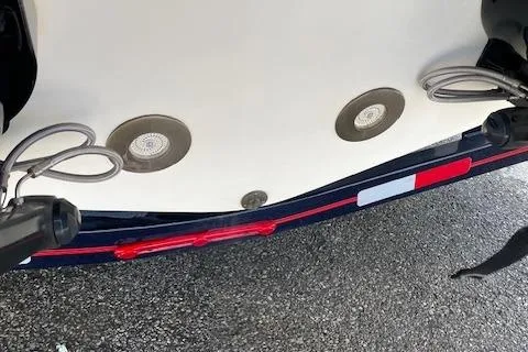 Slide: The Image of 2008 Chris-Craft Launch 28 boat underside with lights and propellers visible. - 8