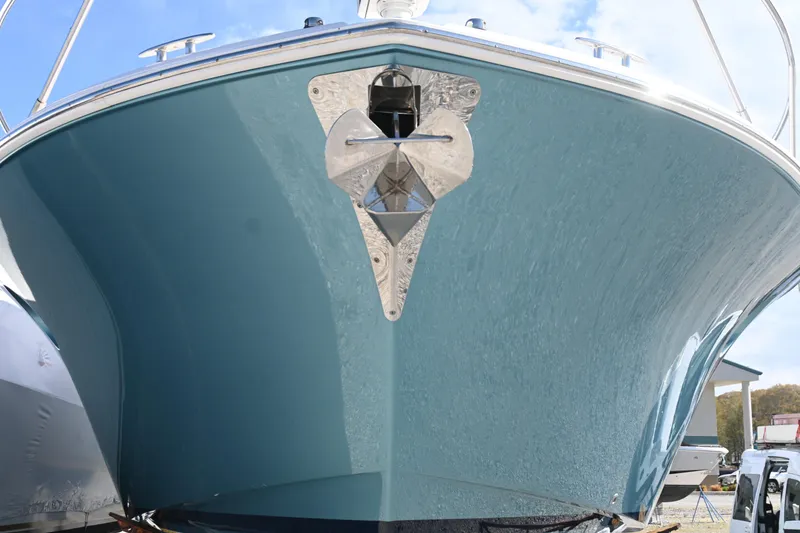 Slide: The Image of Luxurious interior of 2017 Tiara 44 Coupe with white leather seating and wooden table. - 10