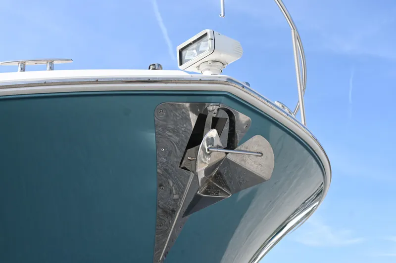 Slide: The Image of 2017 Tiara 44 Coupe yacht docked at marina, featuring spacious deck and modern design. - 13
