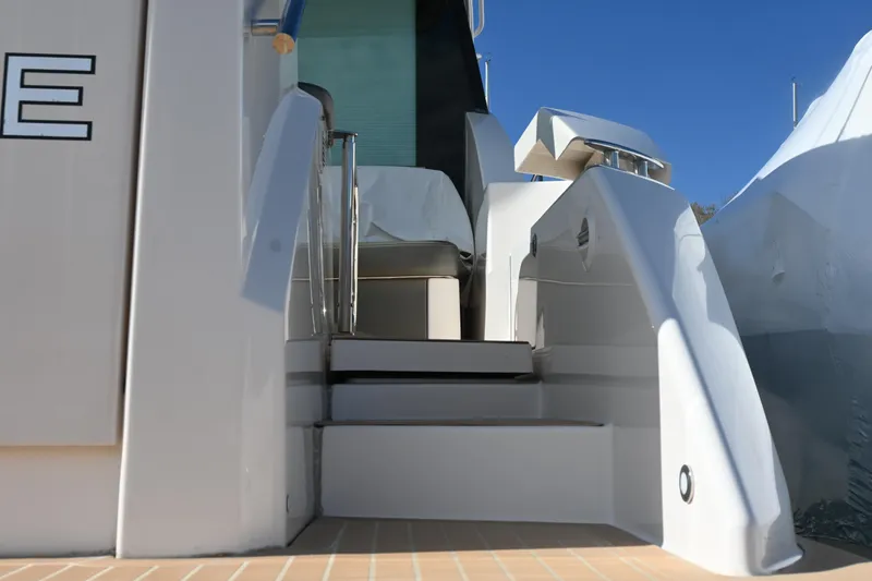 Slide: The Image of 2017 Tiara 44 Coupe yacht on stands, side view, outdoors. - 16