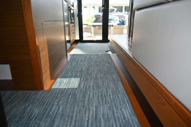 Slide: The Image of Luxurious bedroom interior of 2017 Tiara 44 Coupe yacht with cozy lighting. Nighttime view - 35