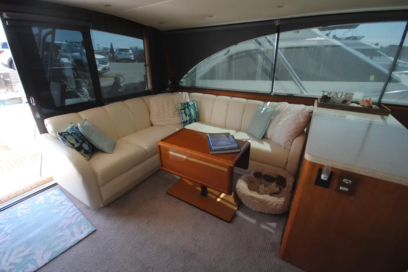 Slide: The Image of Luxurious interior of 1999 Ocean Yachts 45 Super Sport with cozy seating and elegant decor. - 16