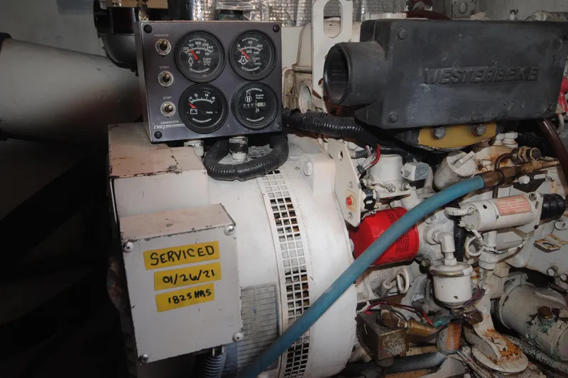 Slide: The Image of Engine compartment of a 1999 Ocean Yachts 45 Super Sport, showing gauges and service label. - 35