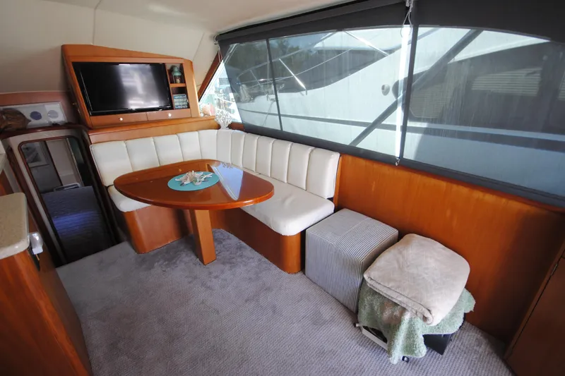 Slide: The Image of Luxurious interior of 1999 Ocean Yachts 45 Super Sport with seating and TV. - 17