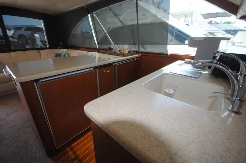 Slide: The Image of Interior of 1999 Ocean Yachts 45 Super Sport with kitchen and seating area. - 20