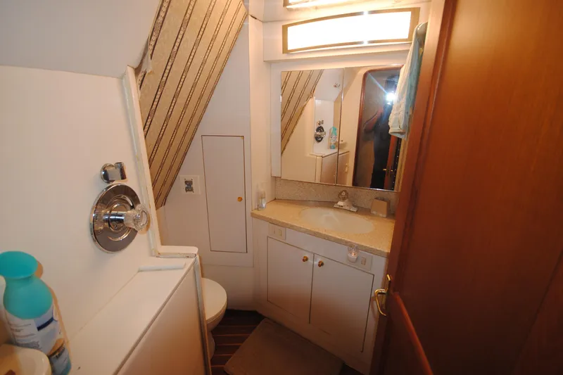 Slide: The Image of Bathroom interior of 1999 Ocean Yachts 45 Super Sport with sink and shower. - 30