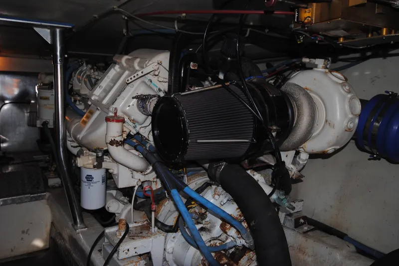Slide: The Image of Engine room of a 1999 Ocean Yachts 45 Super Sport, showcasing mechanical components. - 31