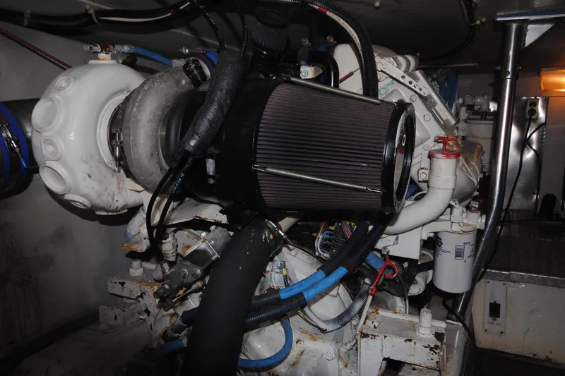 Slide: The Image of Engine room of 1999 Ocean Yachts 45 Super Sport, showcasing mechanical components and filters. - 33