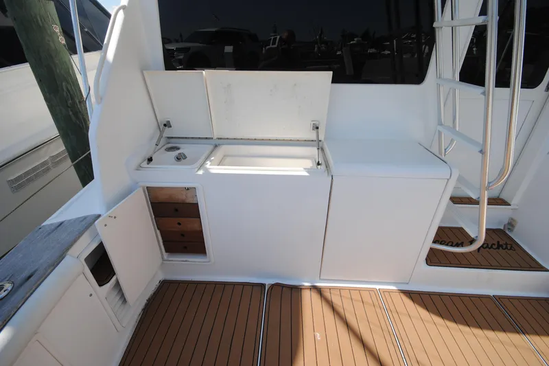 Slide: The Image of 1999 Ocean Yachts 45 Super Sport yacht deck with storage and ladder. - 4