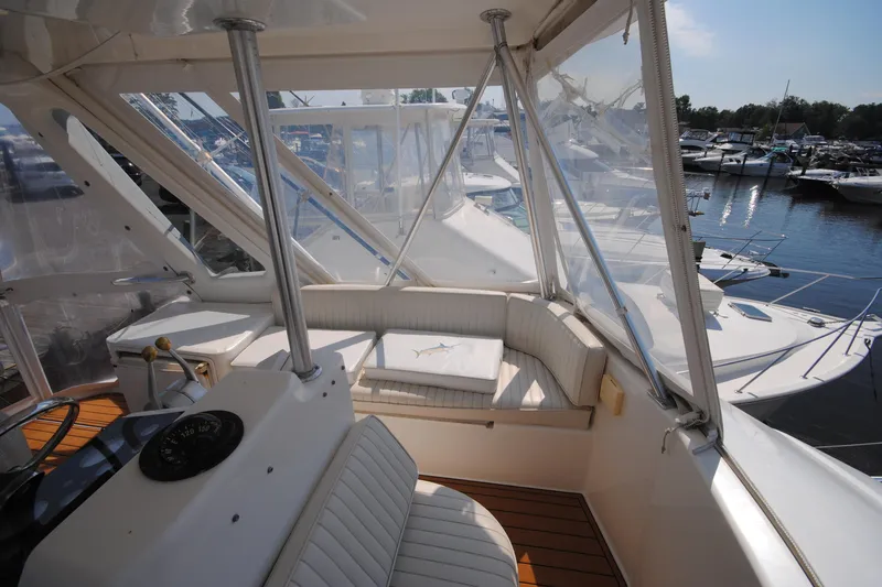 Slide: The Image of 1999 Ocean Yachts 45 Super Sport yacht interior with seating and marina view. - 9