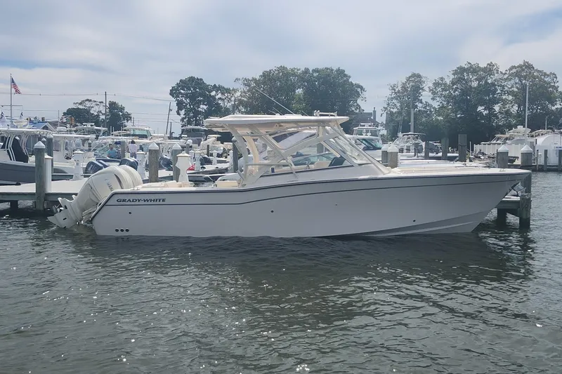 The Image of 2026 Grady-White Freedom 307 boat docked at marina, side view. - 0