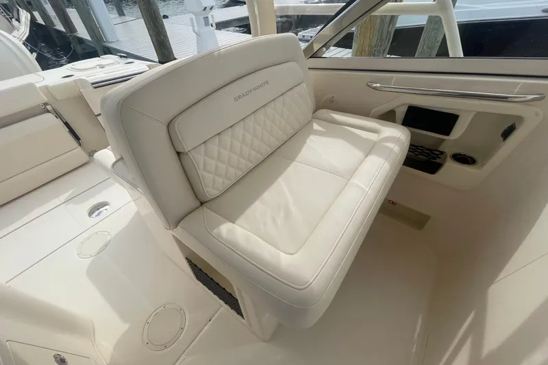 Slide: The Image of 2026 Grady-White Freedom 307 boat interior with luxurious seating and elegant design. - 14