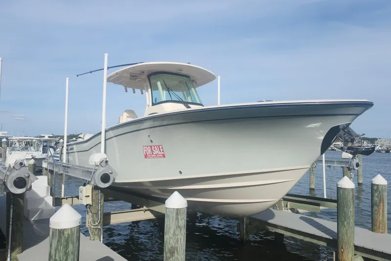 The Image of 2026 Grady-White Canyon 271 boat for sale at dock, clear sky background. - 0