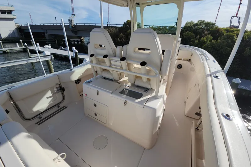 Slide: The Image of 2026 Grady-White Canyon 271 boat interior with seating and helm station. - 12