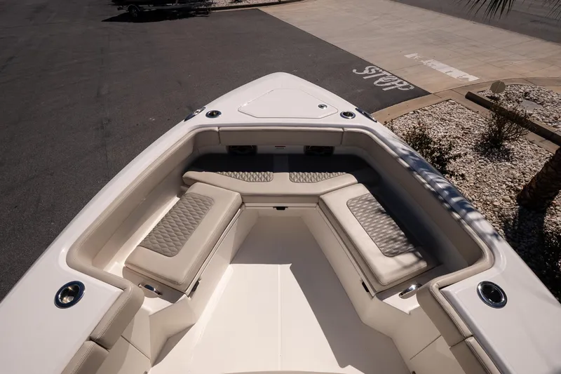 Slide: The Image of 2026 Solace 30 HCS boats with Mercury engines in a marina under clear skies. - 20