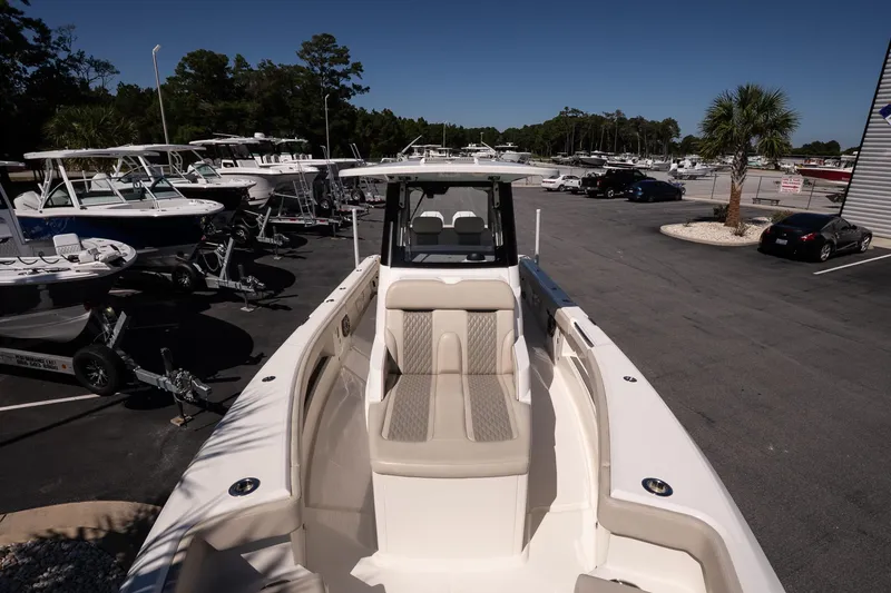 Slide: The Image of 2026 Solace 30 HCS boat helm with advanced navigation system and steering wheel. - 21