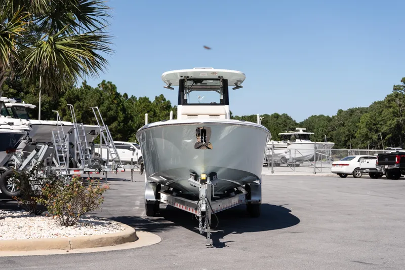 Slide: The Image of 2026 Solace 30 HCS boat on calm water near dockside houses and green marker 45B. - 3