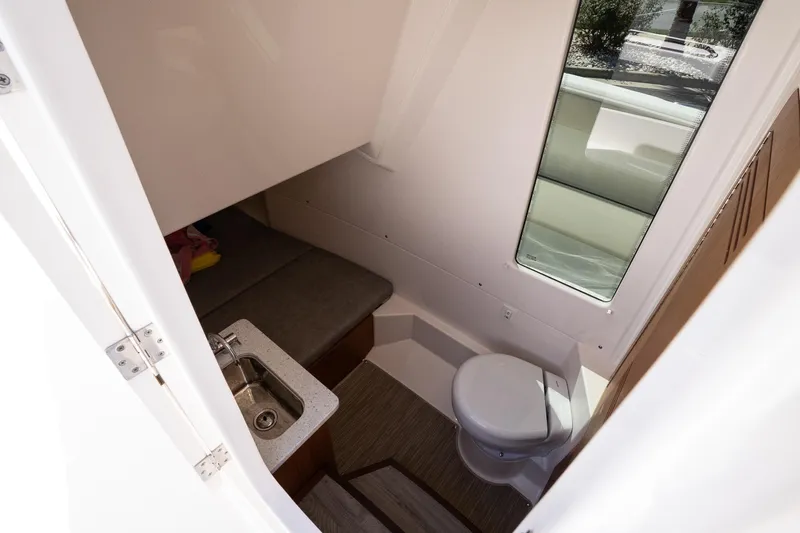 Slide: The Image of Interior cabin of 2026 Solace 30 HCS boat with sink and toilet. - 31