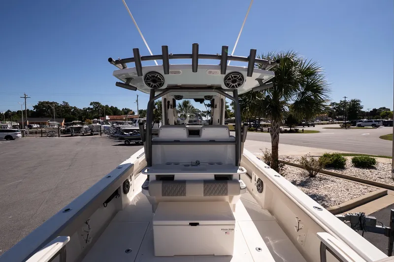 Slide: The Image of 2026 Solace 30 HCS boat on calm water near marina at sunset. - 6