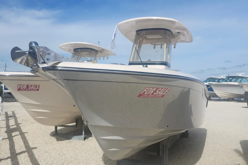 Slide: The Image of 2026 Grady-White Fisherman 236 boat for sale, displayed outdoors on gravel. - 1