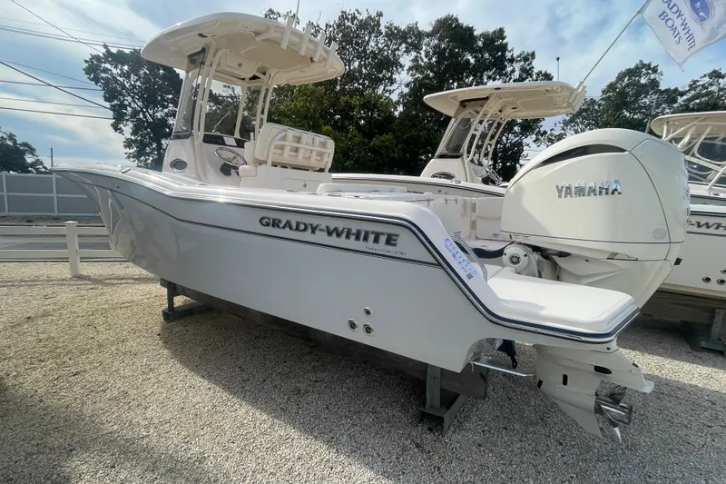 Slide: The Image of 2026 Grady-White Fisherman 236 boat with Yamaha engine on display. - 2