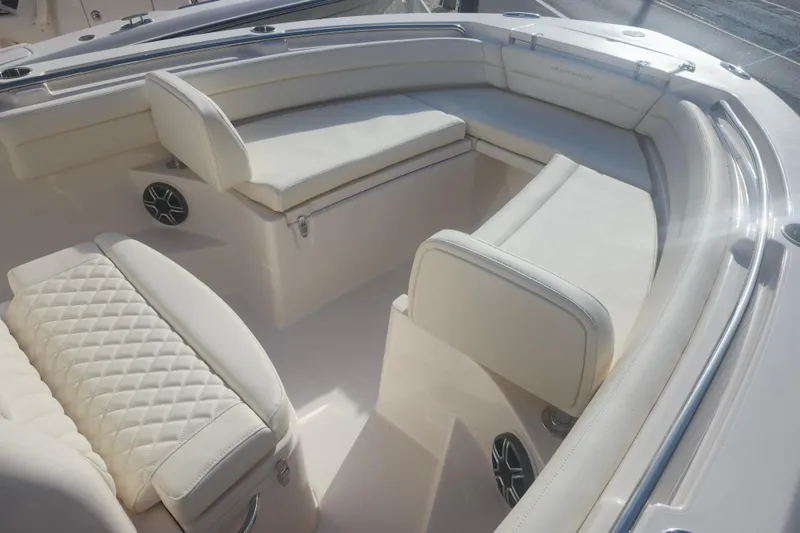 Slide: The Image of Luxurious seating on 2026 Grady-White Fisherman 236 boat, featuring elegant white upholstery. - 8