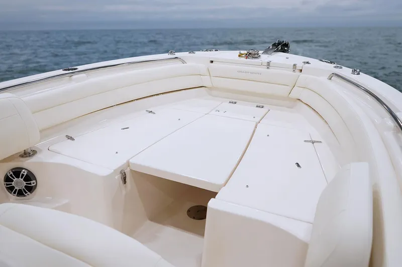 Slide: The Image of 2026 Grady-White Fisherman 236 boat interior with white seating and steering wheel. - 4