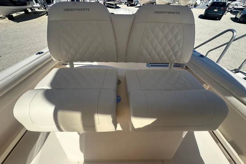Slide: The Image of 2026 Grady-White Fisherman 216 boat seats with quilted upholstery in a sunny setting. - 11