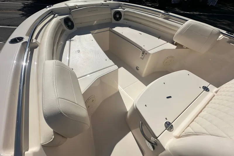 Slide: The Image of 2026 Grady-White Fisherman 216 boat interior with cushioned seating and storage compartments. - 12
