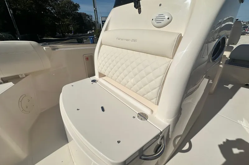 Slide: The Image of 2026 Grady-White Fisherman 216 boat interior with cushioned seating and storage. - 14