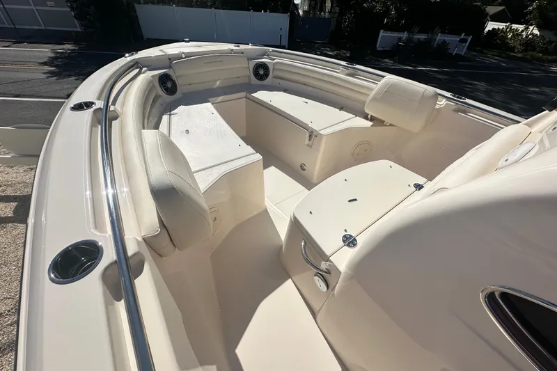 Slide: The Image of 2026 Grady-White Fisherman 216 boat interior with cushioned seating and storage compartments. - 16