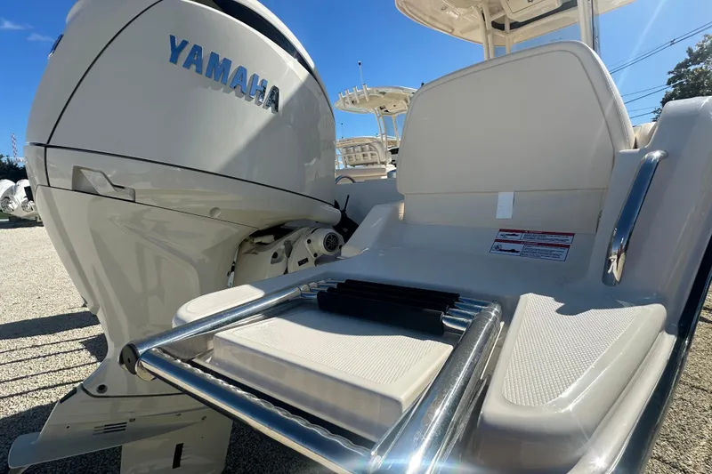 Slide: The Image of 2026 Grady-White Fisherman 216 boat with Yamaha engine, featuring a comfortable seating area. - 3