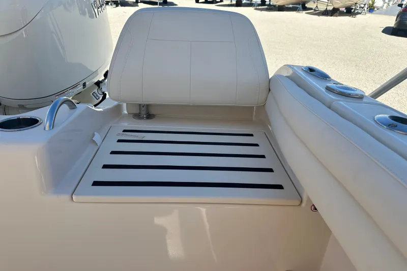 Slide: The Image of 2026 Grady-White Fisherman 216 boat seat with cup holders and storage area. - 4