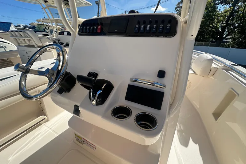 Slide: The Image of 2026 Grady-White Fisherman 216 boat console with steering wheel and controls. - 9