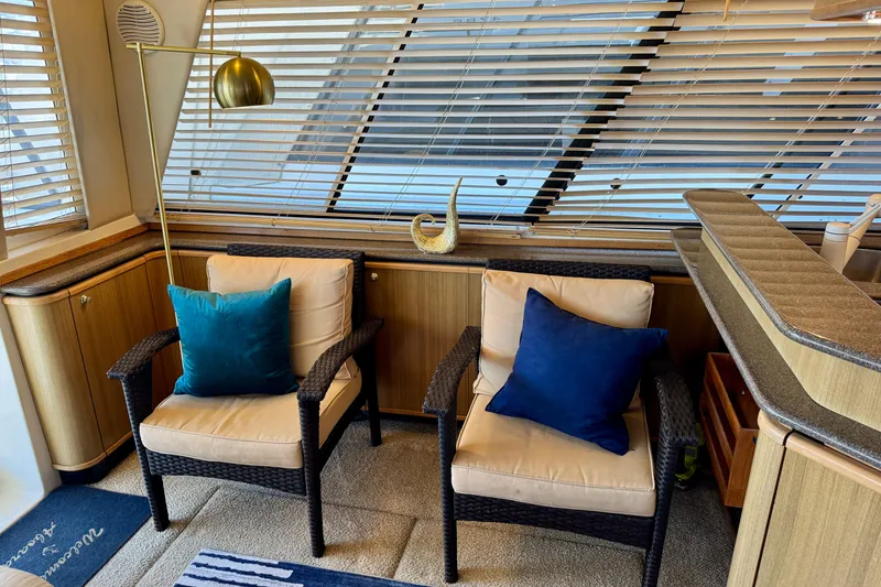 Slide: The Image of Interior of 2000 Bayliner 4788 Pilot House Motoryacht with cozy seating and stylish decor. - 12