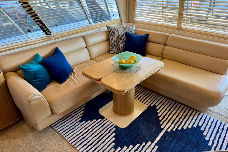 Slide: The Image of Luxurious interior of 2000 Bayliner 4788 Pilot House Motoryacht with plush seating and stylish decor. - 13