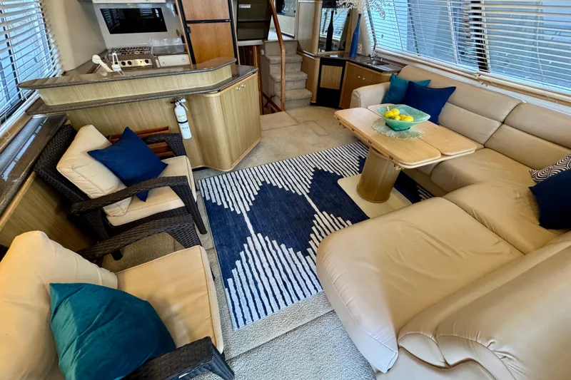 Slide: The Image of Luxurious interior of 2000 Bayliner 4788 Pilot House Motoryacht with cozy seating and modern decor. - 15