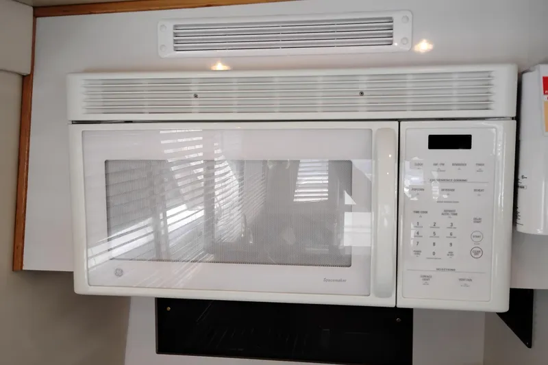Slide: The Image of Microwave oven in 2000 Bayliner 4788 Pilot House Motoryacht kitchen area. - 18