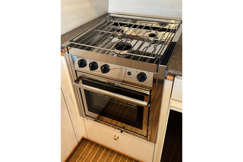 Slide: The Image of Stainless steel stove and oven in 2000 Bayliner 4788 Pilot House Motoryacht kitchen. - 19