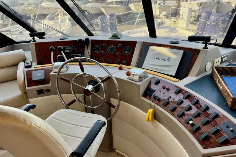 Slide: The Image of Pilot house of 2000 Bayliner 4788 Motoryacht with Garmin navigation system and control panel. - 22
